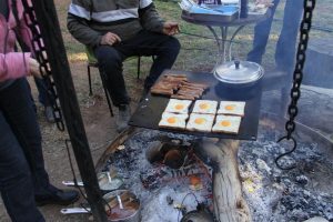 Who's hungry? Breakfast of champions over the campfire.