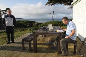 Not a bad place to call the office. Richard finds time for some flight planning on Three Hummock.