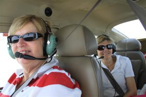 Julie Lockyer (front) and my sister Randi all smiles enroute as we leave behind the smog of Sydney.